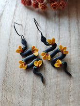 Load image into Gallery viewer, Black Sunflower Snake Dangles
