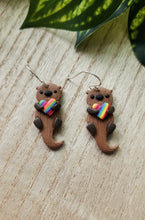 Load image into Gallery viewer, PRIDE Rainbow Heart Otter Dangles
