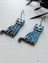 Load image into Gallery viewer, Colorshift Skelly Cat Dangle Earrings
