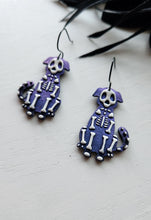 Load image into Gallery viewer, Colorshift Skelly Dog Dangle Earrings
