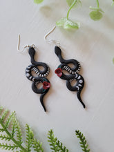 Load image into Gallery viewer, Black Moon Phase Floral Snake Dangles
